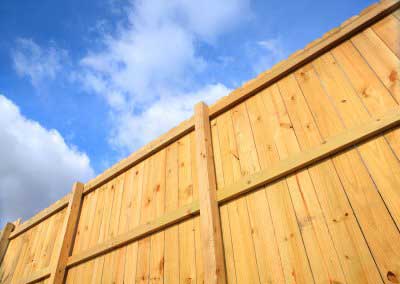 Wood-styled privacy fence installed for a house in Palm Beach County, FL