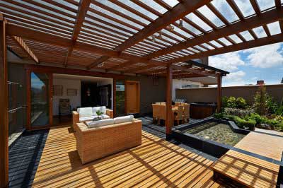 A house deck with a wooden fence was installed by Fencing South Florida in Palm Beach County, FL.