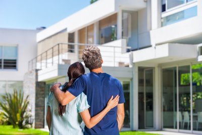 Couple staring at beautiful house