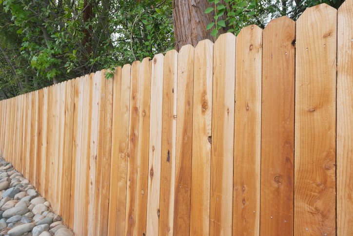 Natural wood fence with vertical panels in Palm Beach County, FL